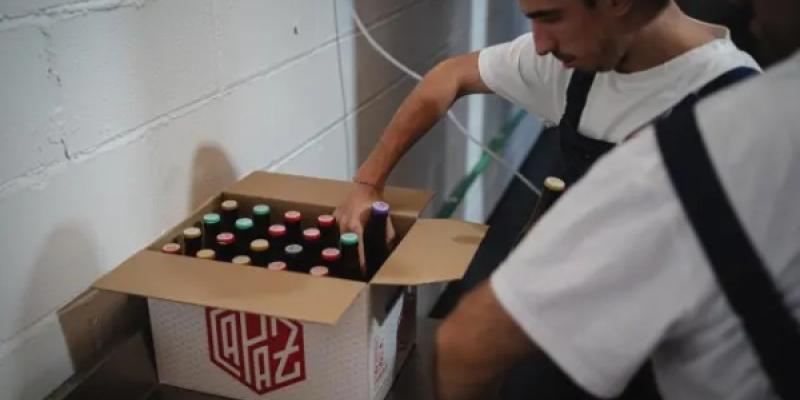 Botellas empaquetadas de la cerveza Capaz