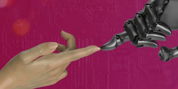 Una mano de una persona acerca su dedo a la mano de un robot