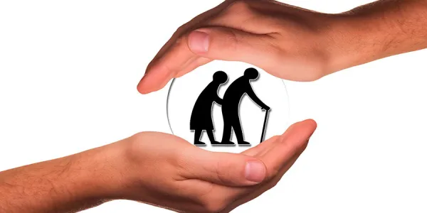 Dos manos sosteniendo a personas con discapacidad